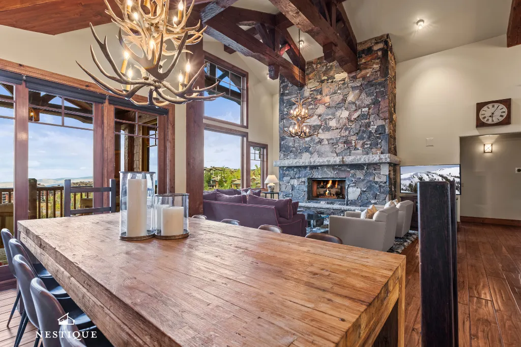 Timber-beamed dining room and stone fireplace at Empire Summit at The Grand Lodge, Deer Valley